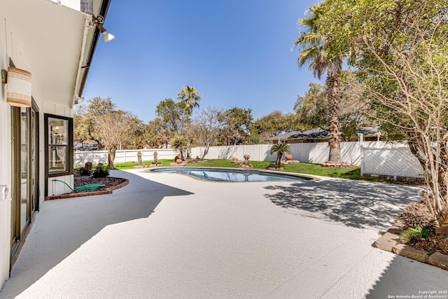 view of swimming pool with a patio area, a fenced backyard, and a fenced in pool