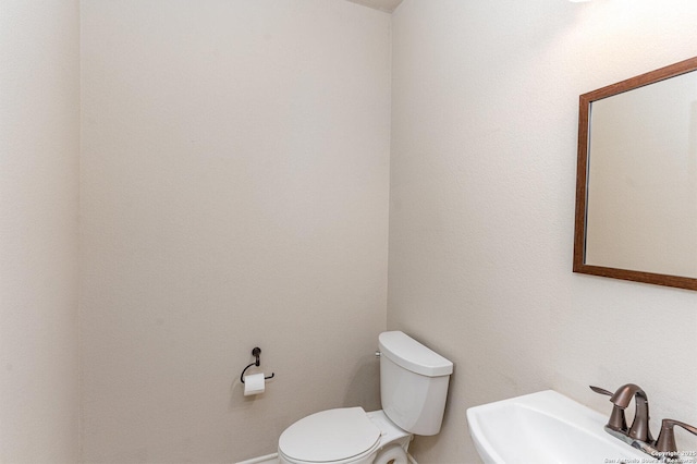 bathroom featuring a sink and toilet