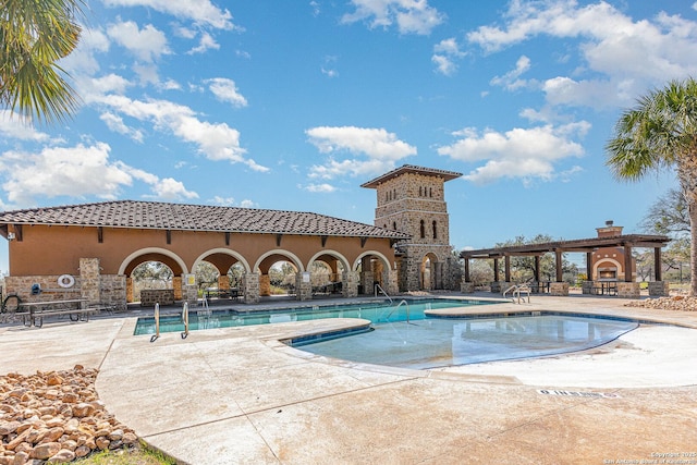 community pool with a patio area