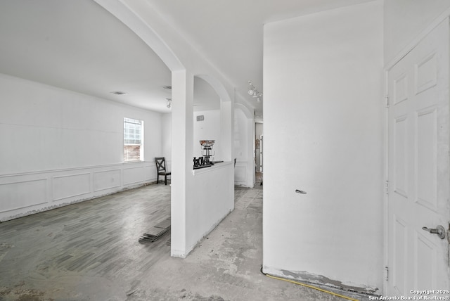 foyer entrance with arched walkways