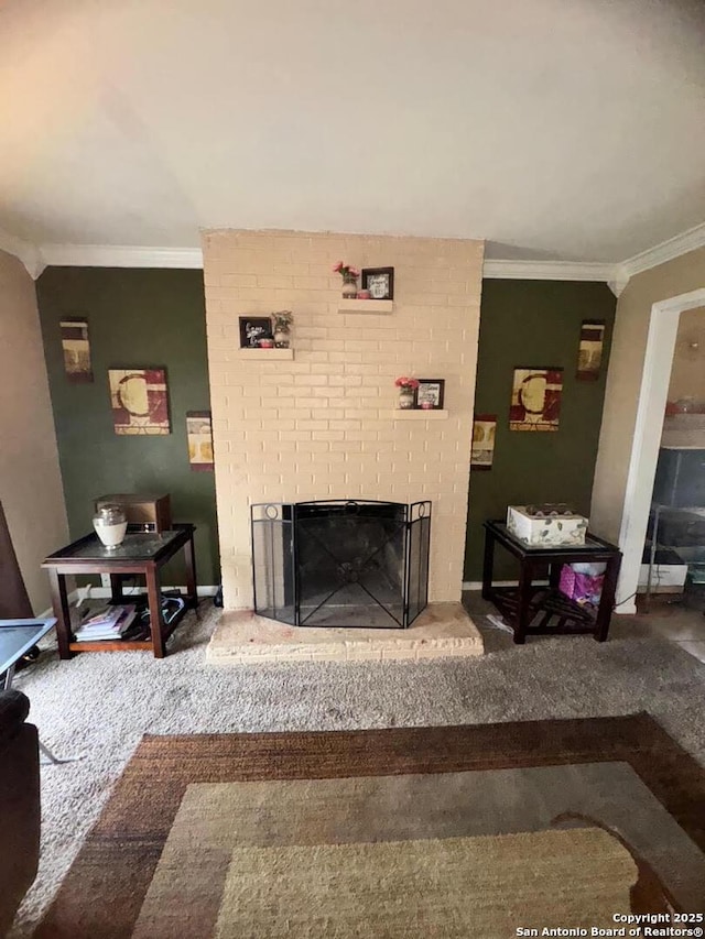 carpeted living room with a brick fireplace and crown molding