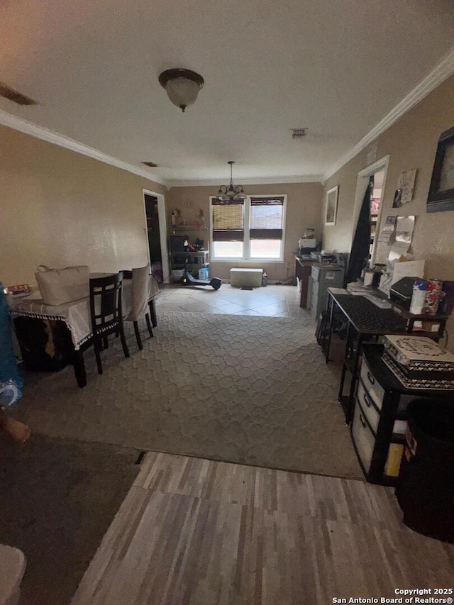 interior space with wood finished floors and crown molding