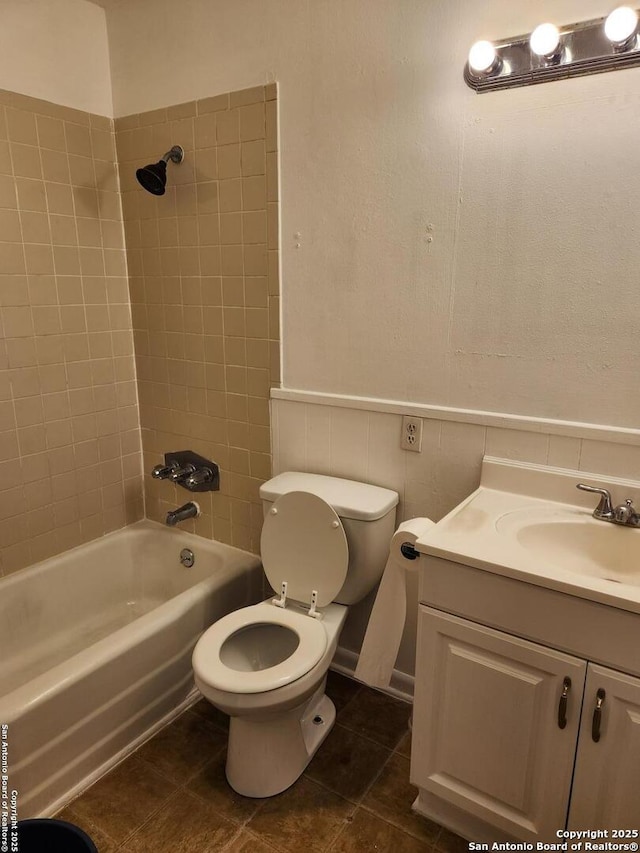 bathroom featuring shower / bath combination, vanity, toilet, and tile patterned floors