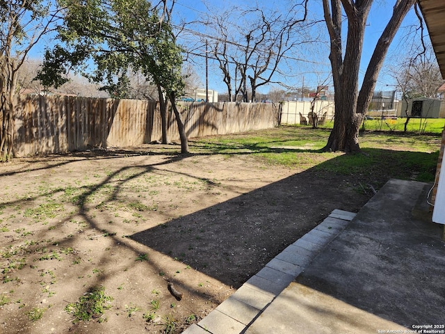 view of yard with a fenced backyard