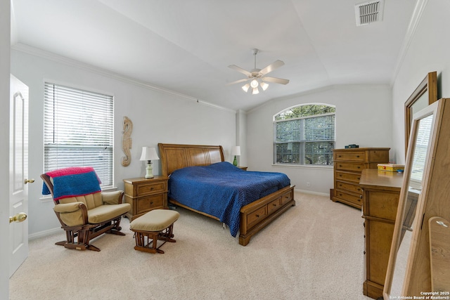 bedroom with ornamental molding, lofted ceiling, light colored carpet, and visible vents