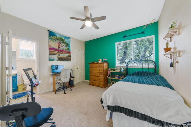 bedroom with a ceiling fan, baseboards, and carpet flooring