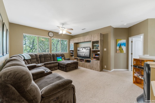 carpeted living room with ceiling fan, visible vents, and baseboards