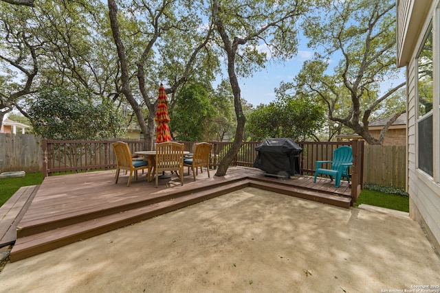 exterior space with a patio area, a fenced backyard, outdoor dining area, and area for grilling