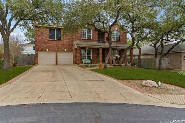 traditional-style house featuring driveway, an attached garage, fence, a front lawn, and brick siding