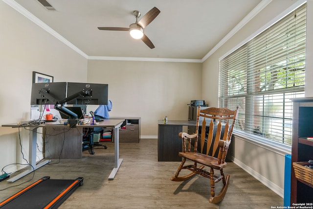 office featuring ornamental molding, visible vents, baseboards, and wood finished floors