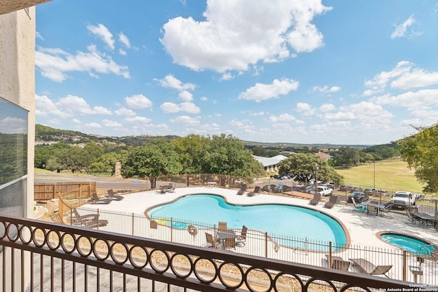 pool featuring a patio and fence