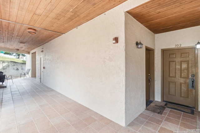 view of exterior entry with stucco siding