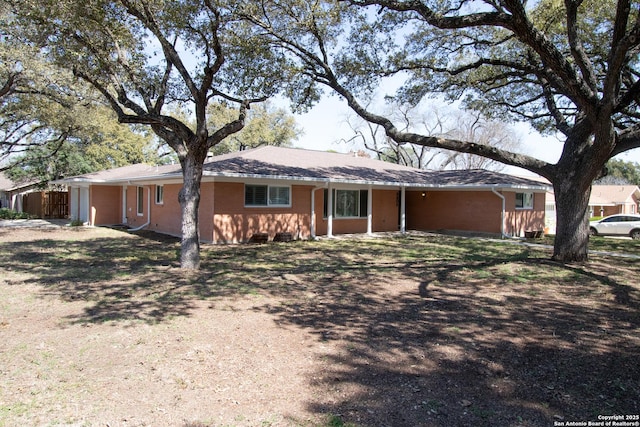 single story home with brick siding