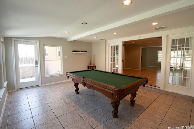 recreation room featuring lofted ceiling, light tile patterned floors, recessed lighting, visible vents, and baseboards