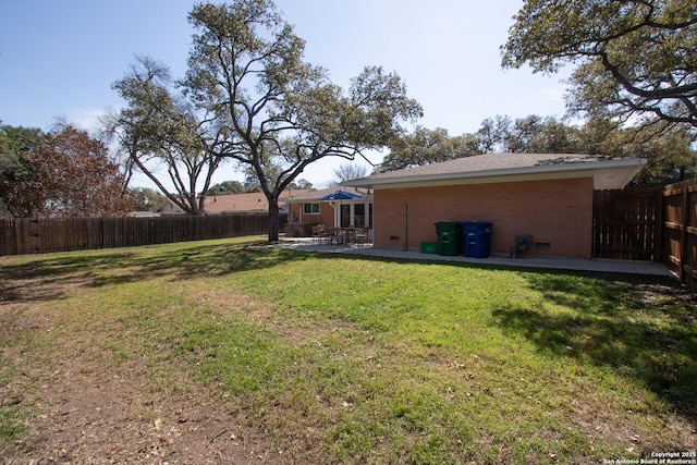 view of yard featuring a patio area and a fenced backyard