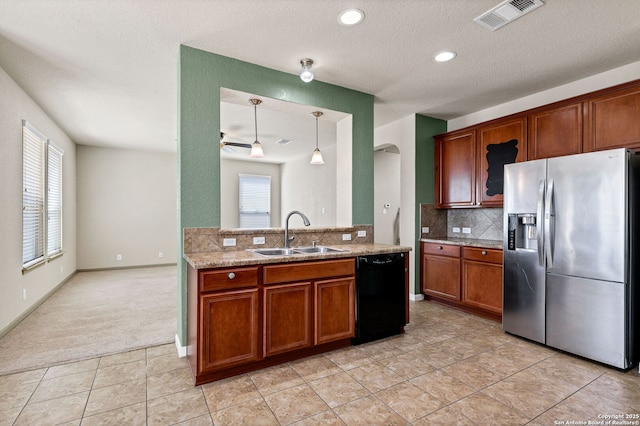 kitchen with black dishwasher, visible vents, arched walkways, stainless steel fridge with ice dispenser, and a sink