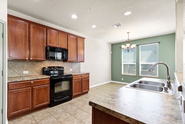 kitchen with brown cabinets, visible vents, decorative backsplash, a sink, and black appliances