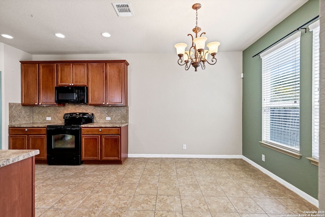 kitchen featuring visible vents, decorative backsplash, brown cabinets, light countertops, and black appliances