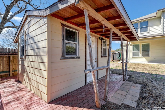 exterior space with fence and a patio