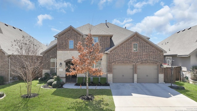 view of front facade featuring a shingled roof, stone siding, brick siding, and a front lawn