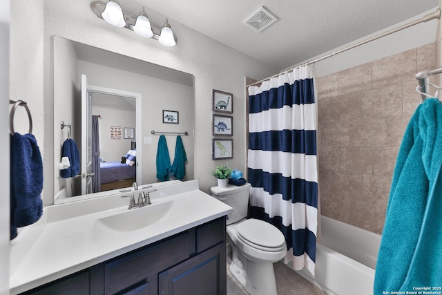 bathroom with visible vents, toilet, ensuite bathroom, a textured ceiling, and vanity