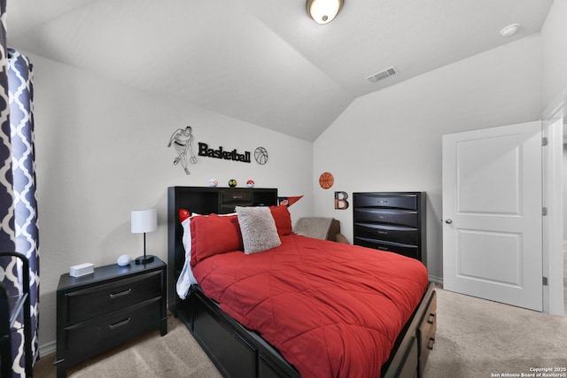 bedroom featuring carpet floors, visible vents, and vaulted ceiling