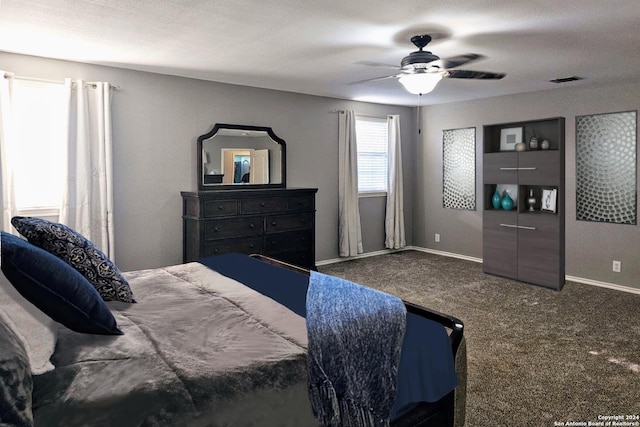 bedroom featuring ceiling fan, carpet floors, visible vents, and baseboards