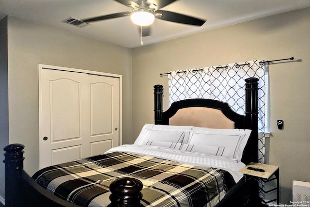 bedroom featuring a closet, visible vents, and a ceiling fan