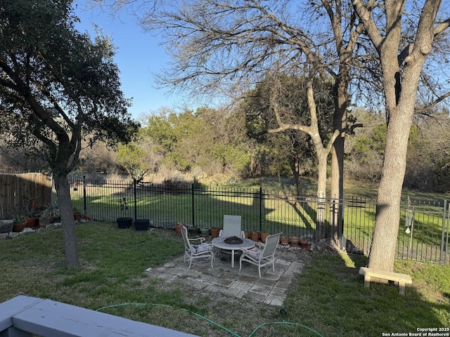 view of yard with a patio and fence