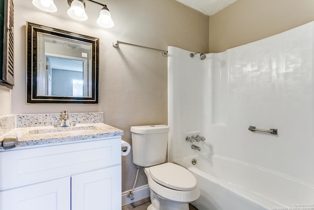 full bathroom featuring shower / bathing tub combination, vanity, toilet, and baseboards