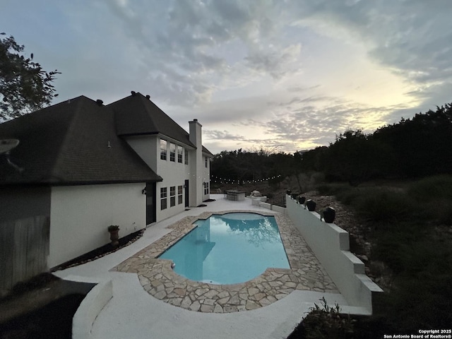 outdoor pool featuring a patio