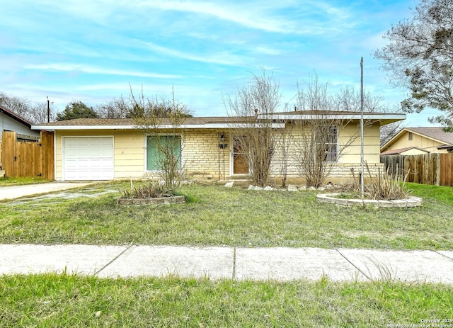 ranch-style house with an attached garage, fence, concrete driveway, stone siding, and a front yard