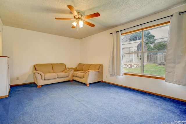 unfurnished living room featuring a textured ceiling, plenty of natural light, carpet flooring, and baseboards