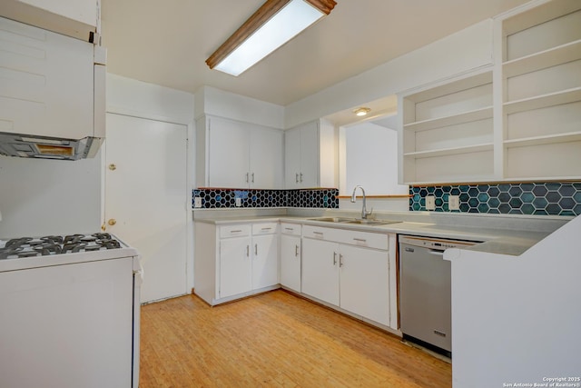 kitchen with open shelves, white gas range, light countertops, stainless steel dishwasher, and a sink