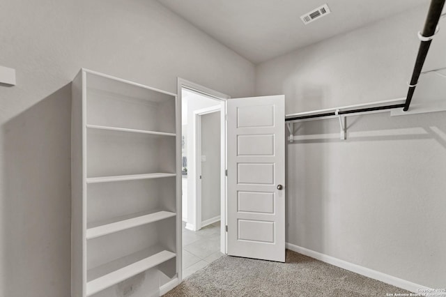 walk in closet featuring carpet and visible vents