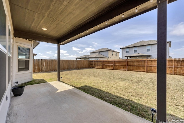 view of yard with a patio area and a fenced backyard