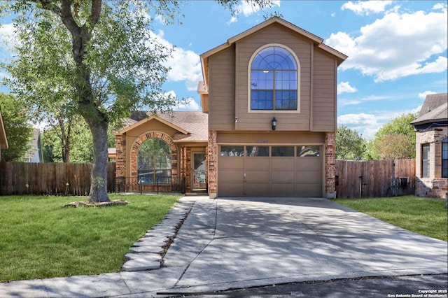 traditional home featuring fence, driveway, and a front lawn