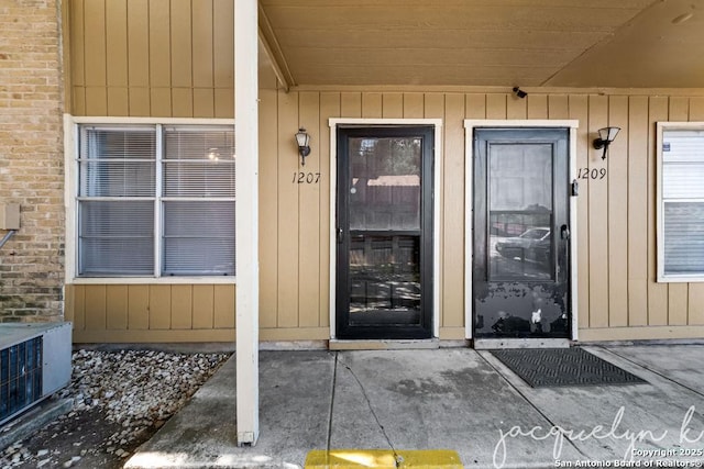 entrance to property featuring central AC unit