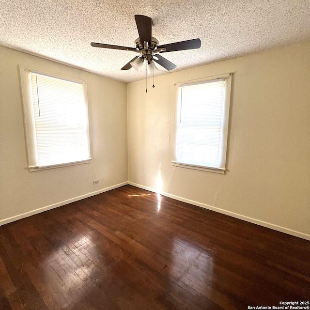 unfurnished room featuring a ceiling fan, baseboards, a textured ceiling, and hardwood / wood-style floors