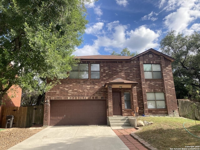 traditional home with concrete driveway, brick siding, fence, and an attached garage