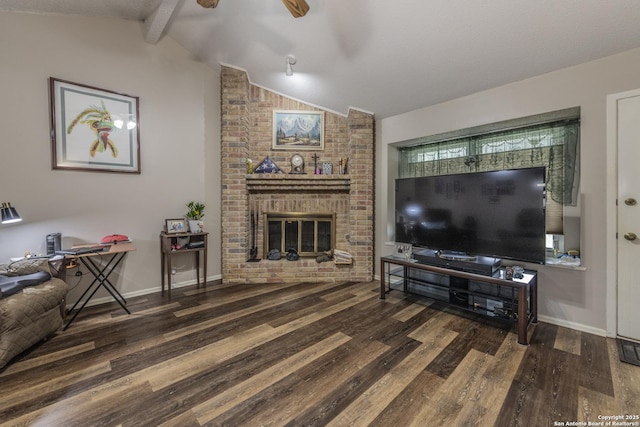 living area with a brick fireplace, vaulted ceiling with beams, and wood finished floors