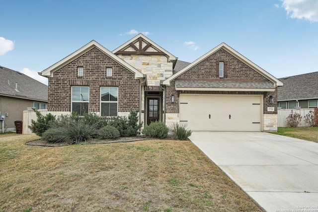 view of front facade featuring brick siding, a garage, stone siding, driveway, and a front lawn