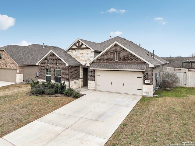 view of front of home featuring a garage, brick siding, concrete driveway, stone siding, and a front yard