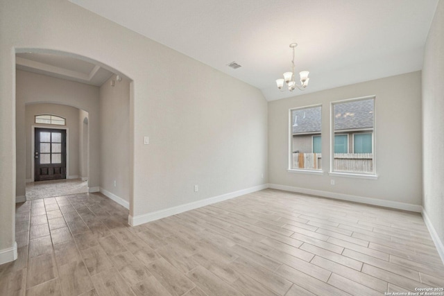 unfurnished room with light wood-type flooring, visible vents, arched walkways, and a chandelier