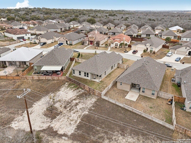 birds eye view of property with a residential view