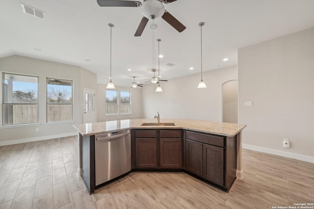 kitchen with arched walkways, visible vents, a sink, light wood-type flooring, and dishwasher