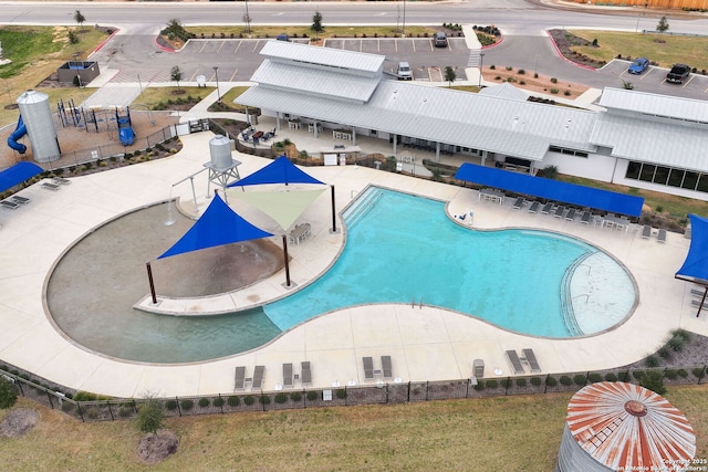 pool featuring a patio area and fence