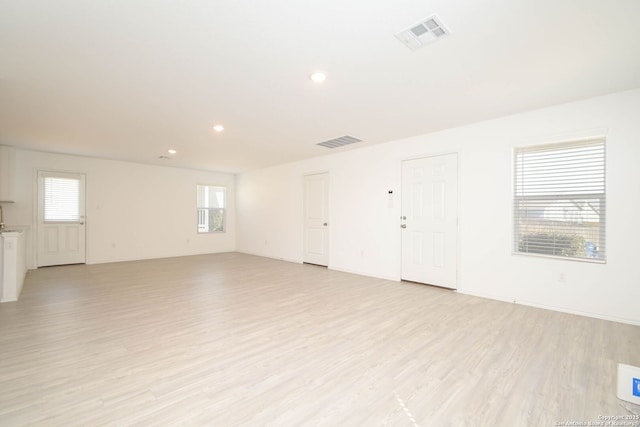 spare room featuring recessed lighting, visible vents, and light wood-style flooring