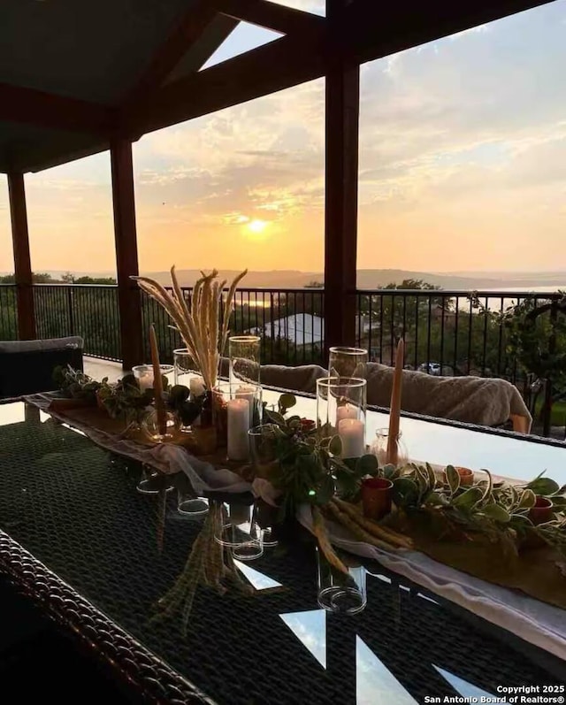 view of balcony at dusk