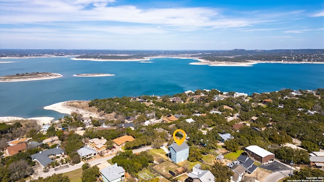 drone / aerial view featuring a water view and a residential view